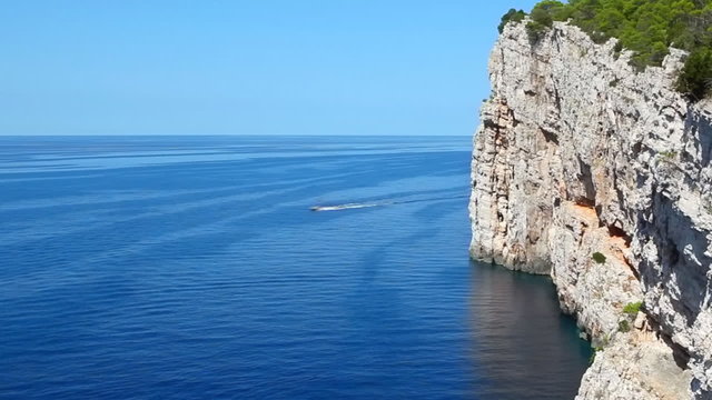 Boat passing Dugi Otok coastline