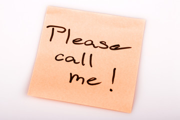 Please call me note on orange sticker note on white
