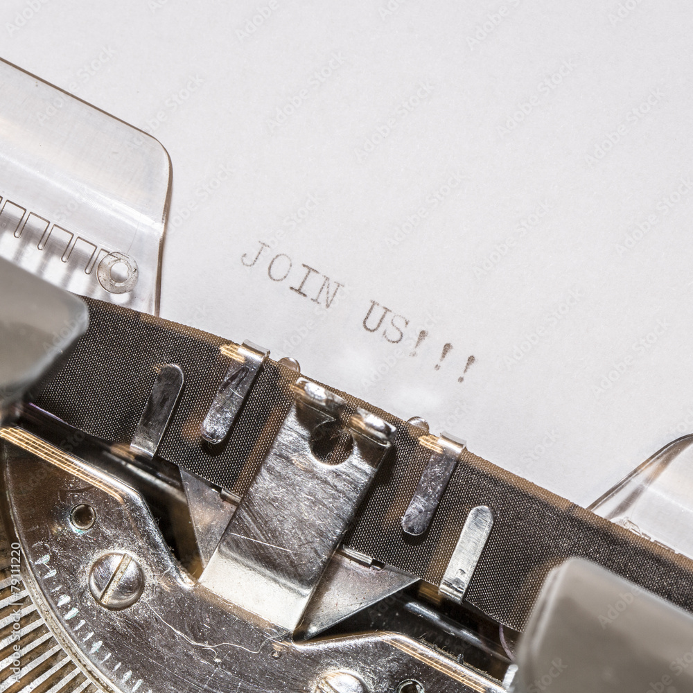 Fototapete old typewriter with text join us