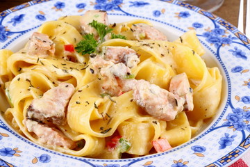 Fish salmon fillet and tagliatelle noodle with cream sauce