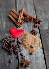 cinnamon sticks and anise stars on rustic wooden background