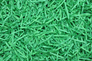 Naklejka premium Shredded paper as background, packaging material 