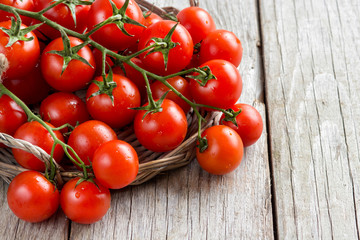 Cherry tomatoes on wood background