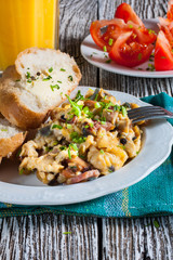 Scrambled eggs with ham and chives.