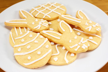 Heap of frosted Easter biscuits on a plate