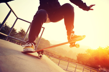 	\skateboarder practice  on sunrise skatepark