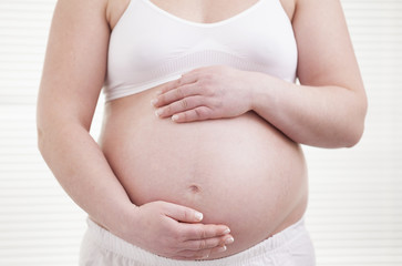 Pregant woman holding his belly