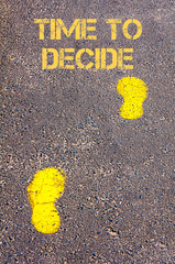 Yellow footsteps on sidewalk towards Time to Decide message