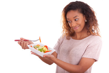 African American woman eating salad, isolated on white backgroun