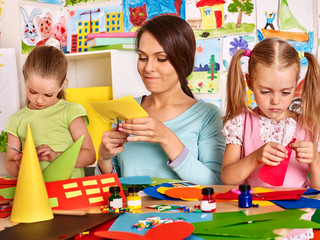 Child cutting out scissors paper.