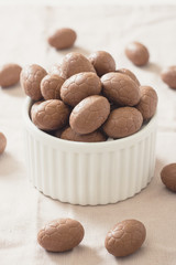 Selective focus on chocolate eggs in the bowl