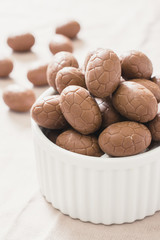 Sweet Easter eggs in white bowl,selective focus