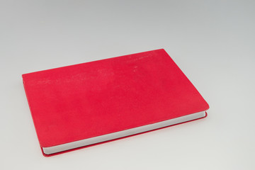 Blank red book isolated on white background with copy space
