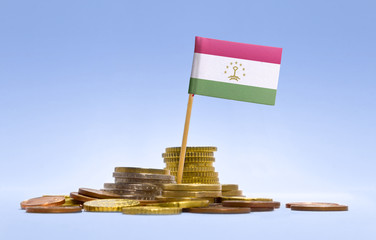 Flag of Tajikistan in a stack of coins.(series)