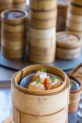 Small steamer baskets of Dim Sum in restaurant