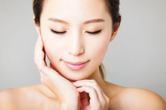 closeup smiling young  beautiful asian woman face