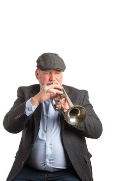 A man playing a vintage silver cornet, trumpet