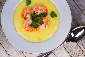 Fennel and potato cream soup with shrimps