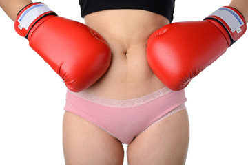 woman with the boxing gloves fight with her belly, Diet concept