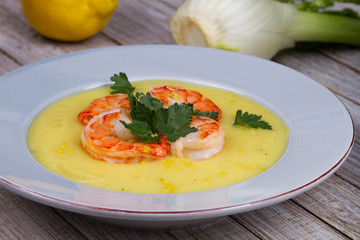 Fennel and potato cream soup with shrimps