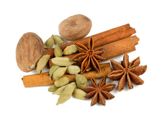 nutmeg, cinnamon, cardamom and star anise isolated on white