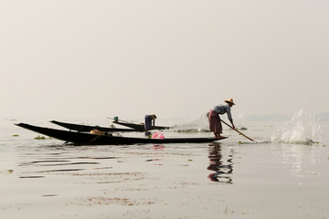 Naklejka premium Fishermen in Inle lakes sunset, Myanmar.