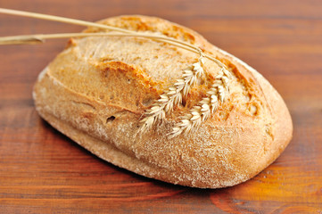 Freshly baked traditional bread on wooden board