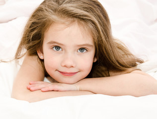 Fototapeta premium Adorable smiling little girl waked up