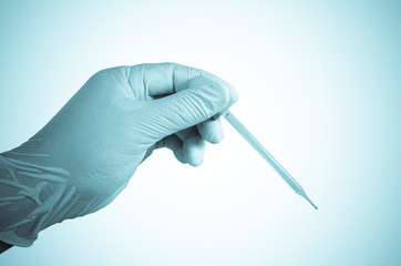 Scientist hand holding dropper ,Laboratory research concept