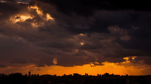 Time lapse of storm clouds over city silhouette - Dark Sky