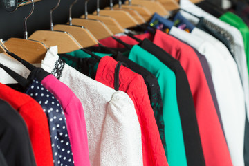 women's dresses on hangers in a retail shop