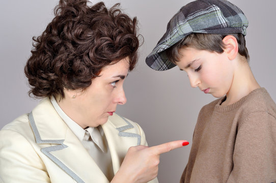 Woman scolding a young boy