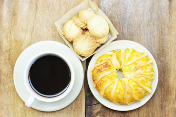 Black coffee and cookies and pineapple bread