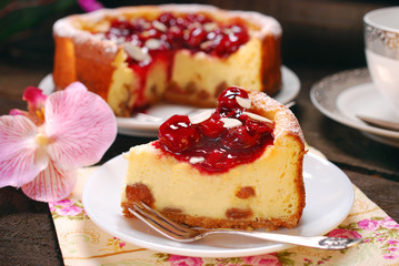 cherry cheesecake on wooden table