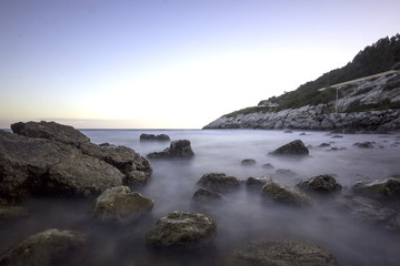 Fototapeta na wymiar Dramatic beach scene Vallcarca, Catalonia