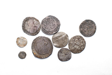 Vintage silver coins with portraits on a white background