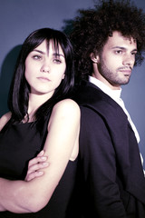 Beautiful fashion couple posing in studio