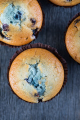 Blueberry muffins on wooden table from above
