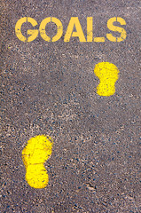 Yellow footsteps on sidewalk towards Goals message