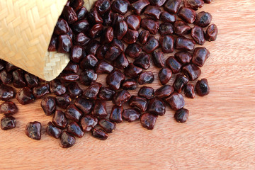 tamarind seed pouring on the wooden floor