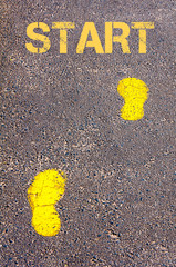 Yellow footsteps on sidewalk towards Start message