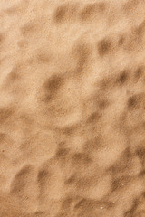 closeup of sand pattern of a beach in the summer