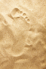 Footprints in sand at the Beach