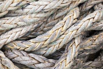 Fototapeta na wymiar Dark gray nautical rope, background texture