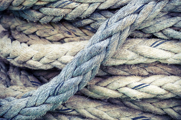 Fototapeta na wymiar Nautical rope, closeup background texture, vintage toned