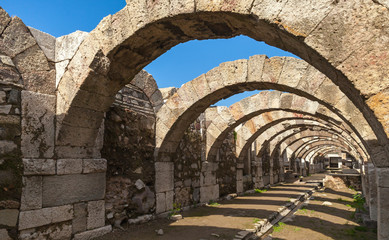Empty corridor with arcs and blue sky. Ruins of Smyrna