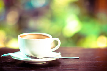 Coffee cup on wood table in coffee shop