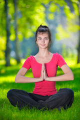 Fototapeta premium Young woman doing yoga exercises