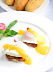 Eggs Benedict- toasted English muffins, ham, poached eggs