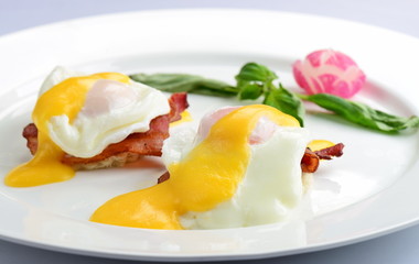 Eggs Benedict- toasted English muffins, ham, poached eggs